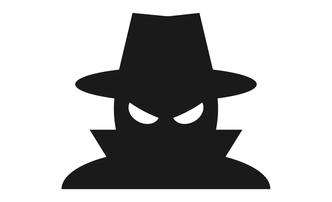 Dessin noir et blanc d'un hacker avec son chapeau